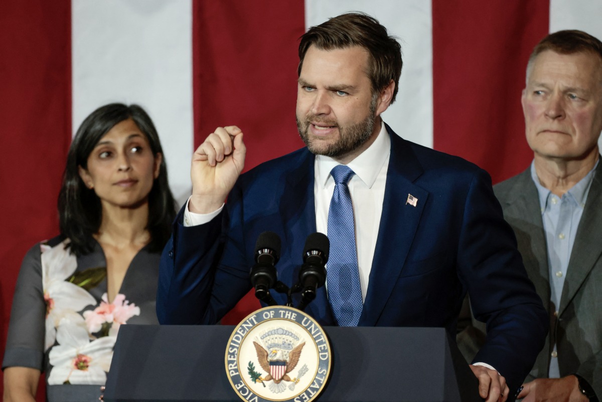 US Vice President JD Vance join by his wife Usha Vance and plant owner Paul Aultman, speaks at Vantage Plastics in Bay City, Michigan, March 14, 2025. (Photo by JEFF KOWALSKY / AFP)
