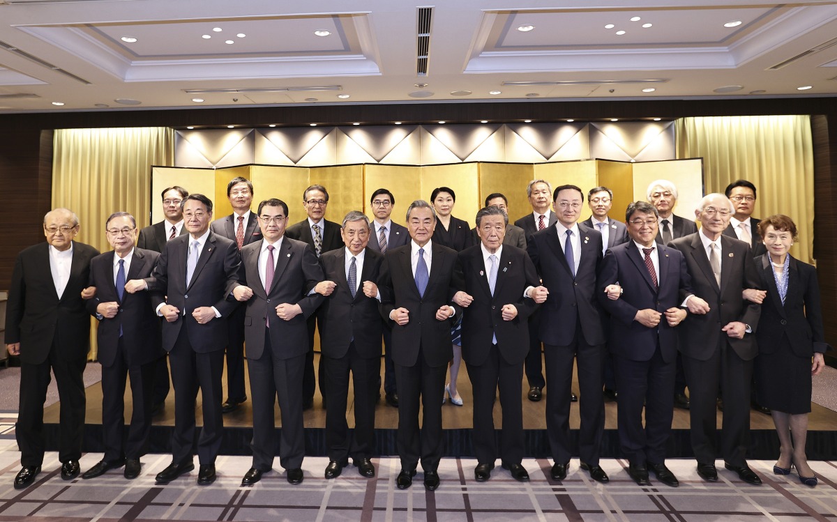 Wang Yi, a member of the Political Bureau of the Communist Party of China (CPC) Central Committee and director of the Office of the Foreign Affairs Commission of the CPC Central Committee, meets with representatives from seven Japan-China friendship groups in Tokyo, Japan, March 23, 2025. (Xinhua/Jia Haocheng)
