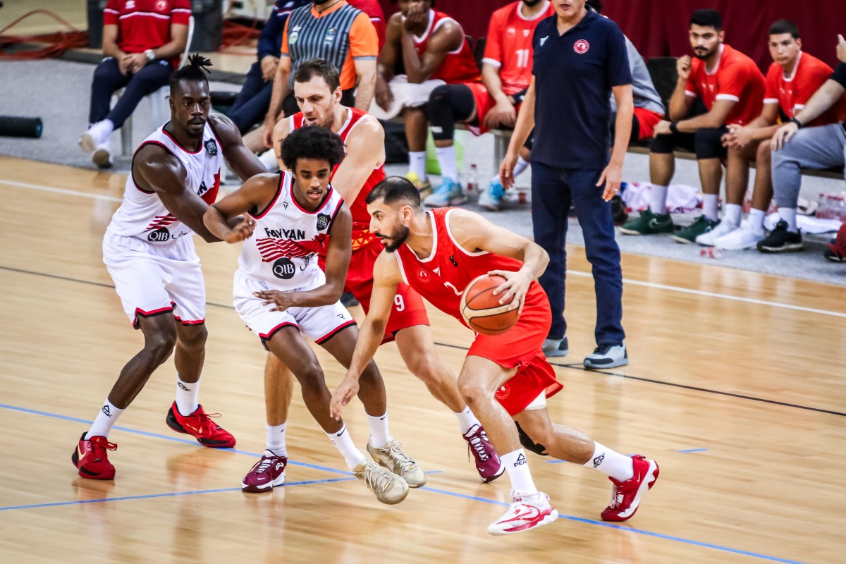 Action during the match between Al Arabi and Al Rayyan.