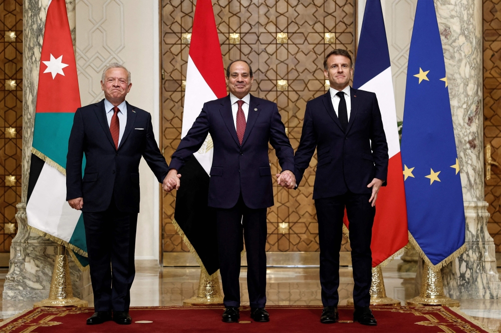 (From left) Jordan's King Abdullah II, Egypt's President Abdel Fattah al-Sisi, and French President Emmanuel Macron pose for a picture during a trilateral summit to discuss the situation in Gaza at the Presidential Palace in Cairo on April 7, 2025. (Photo by Benoit Tessier / POOL / AFP)
